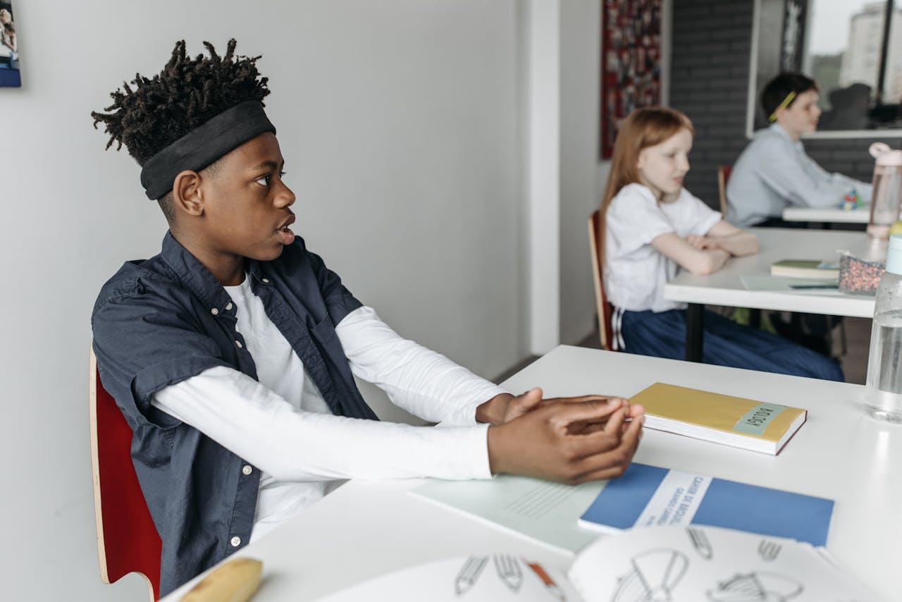 Diverse group of attentive students listening during a class discussion.